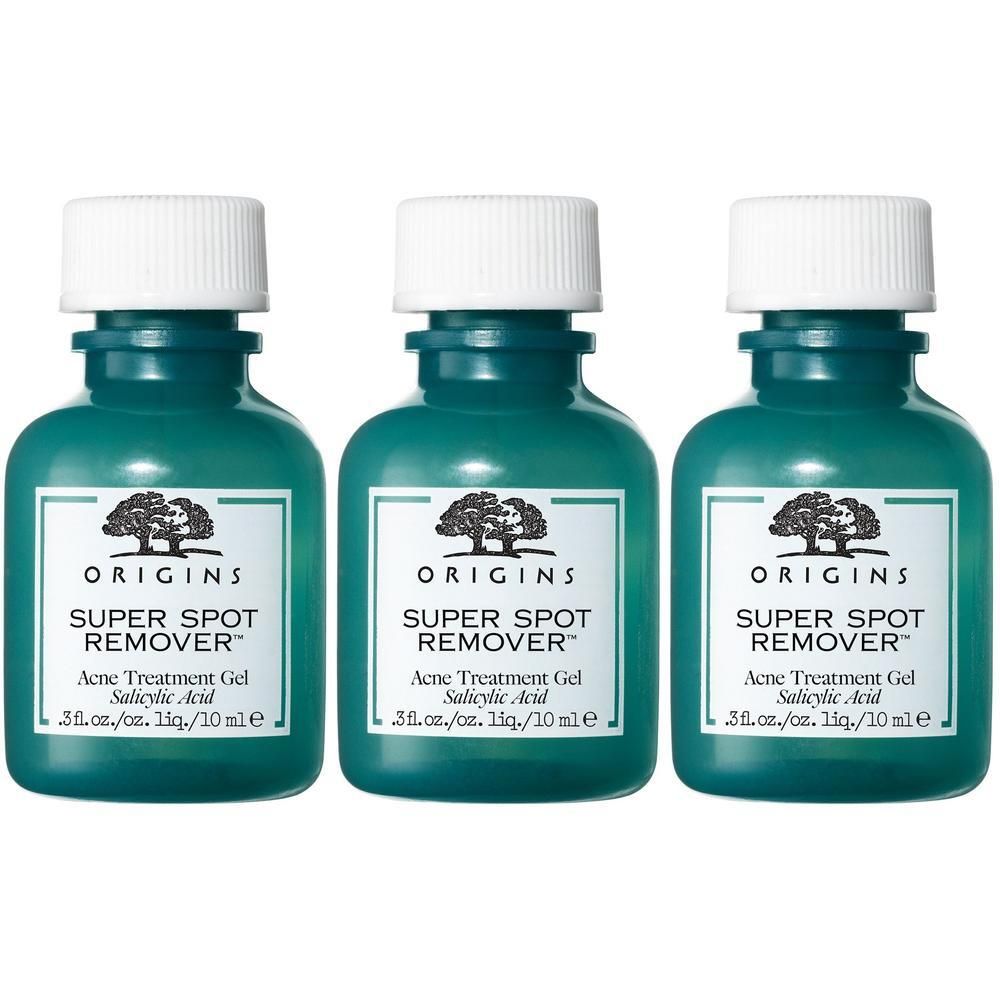 Drie groene flessen met witte doppen. Labels: "ORIGINS SUPER SPOT REMOVER".