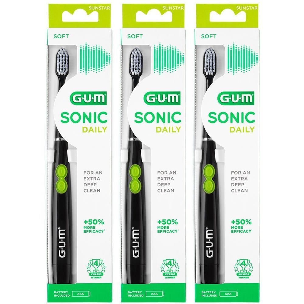 Trois brosses à dents GUM Sonic Daily en emballage. Noires, avec des accents verts. Piles incluses. Marque SUNSTAR.