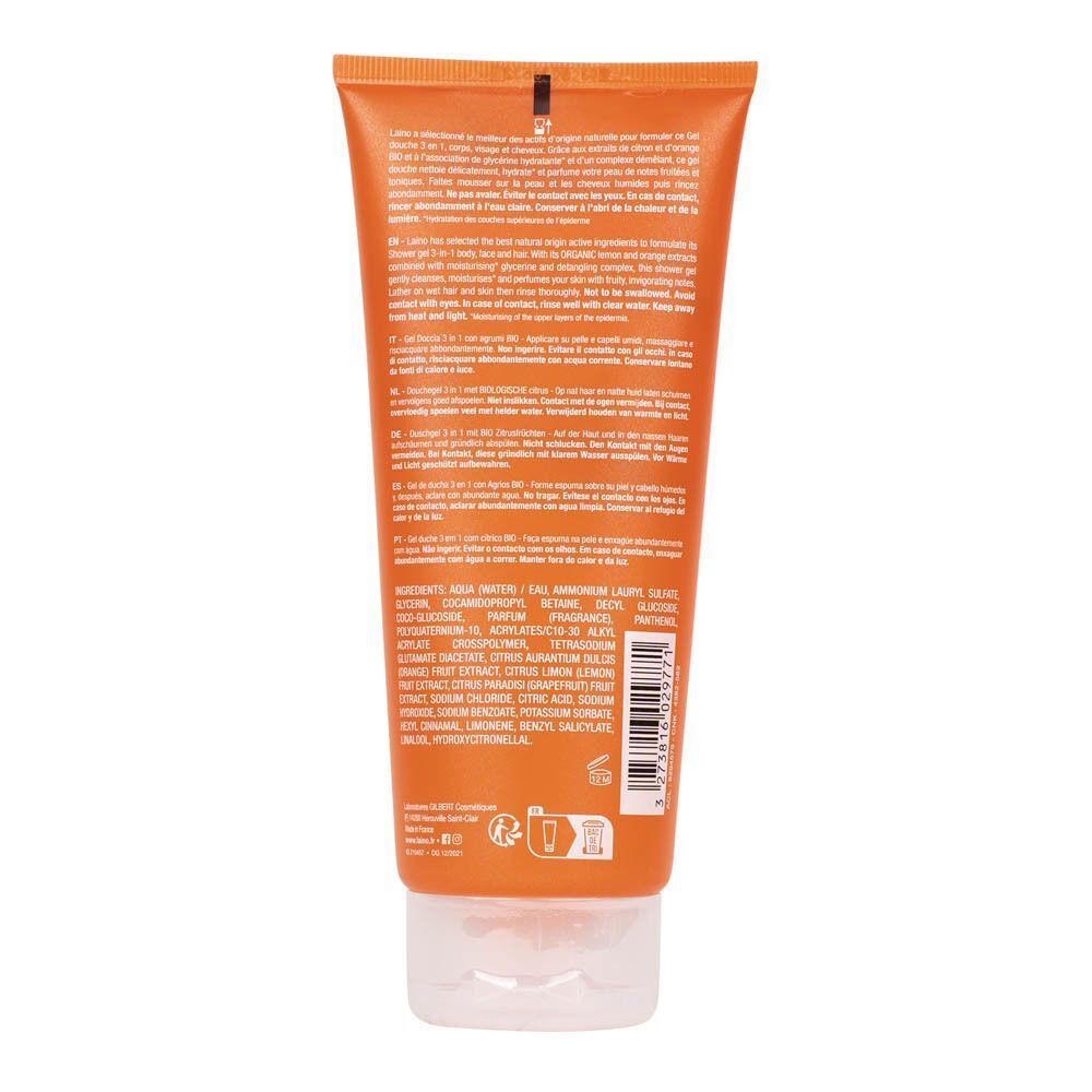 Dos d'un tube de gel douche orange. Texte multilingue, ingrédients et logos.
