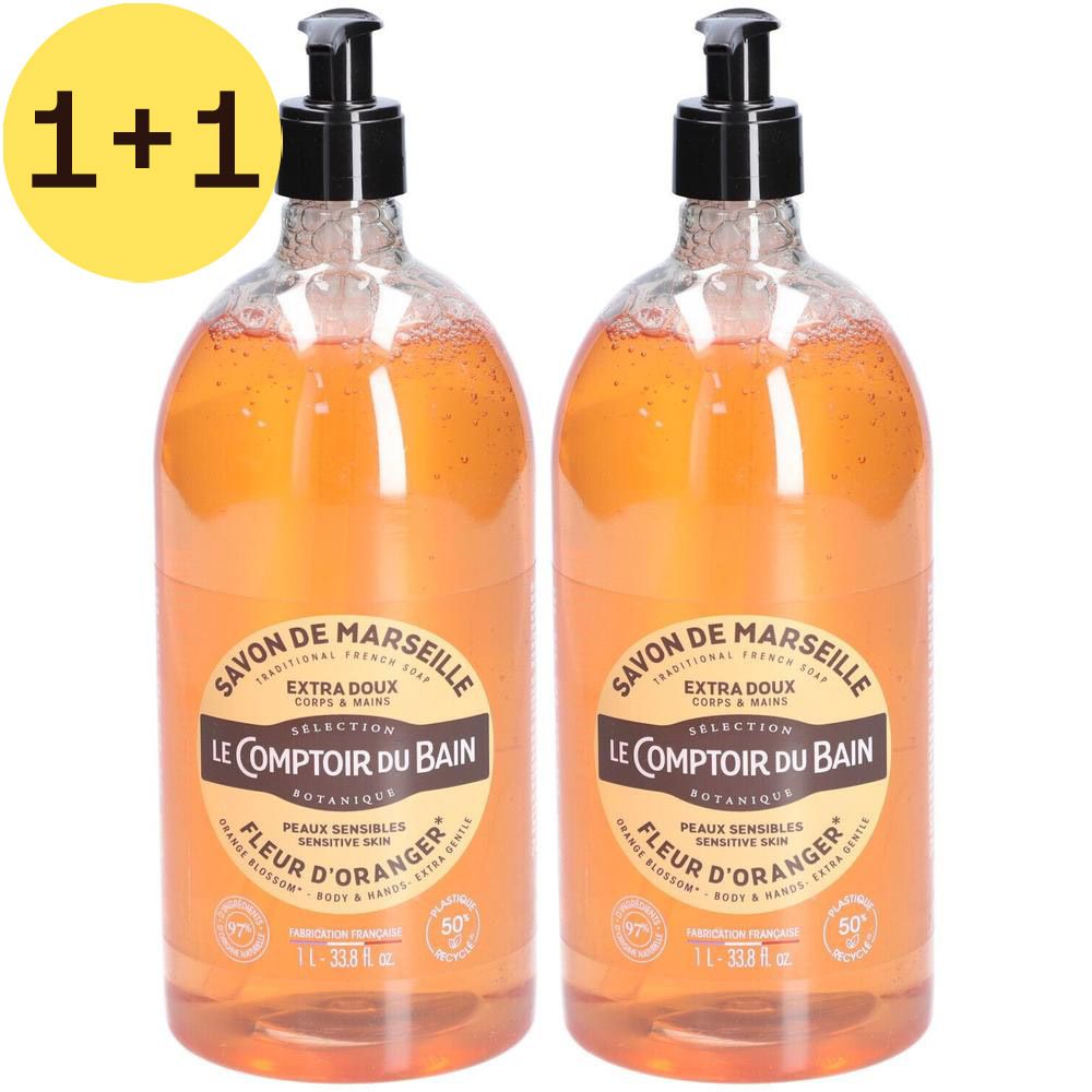 Twee flessen Savon de Marseille Fleur d'Oranger. Transparante flessen met zwarte pomp. Opschrift: Le Comptoir du Bain. 1+1.