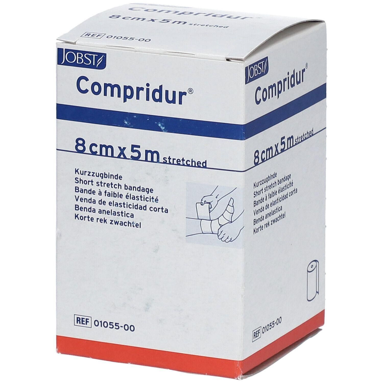 Witte doos Compridur, 8cmx5m, merk JOBST. Bevat korte rek zwachtel. Illustratie van een hand met verband.