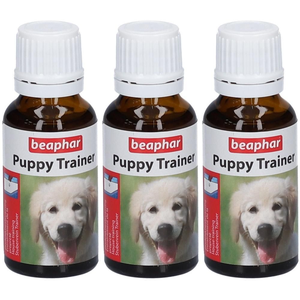 Drie bruine glazen flesjes met witte dop, Beaphar Puppy Trainer.