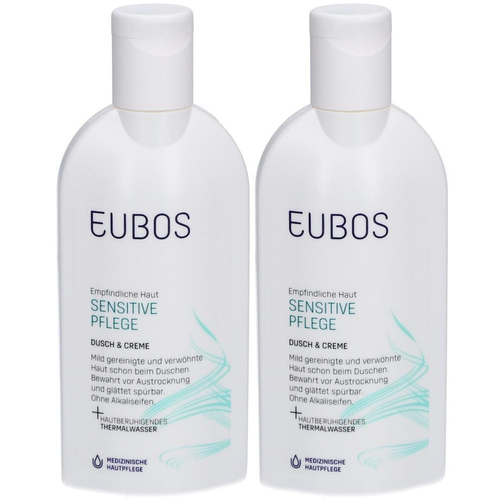 Deux flacons blancs EUBOS Sensitive Pflege Dusch & Creme avec des lignes ondulées turquoise.