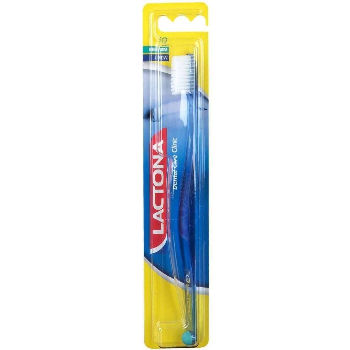 Brosse à dents Lactona IQ Medium sous blister. Manche bleu, tête de brosse blanche.