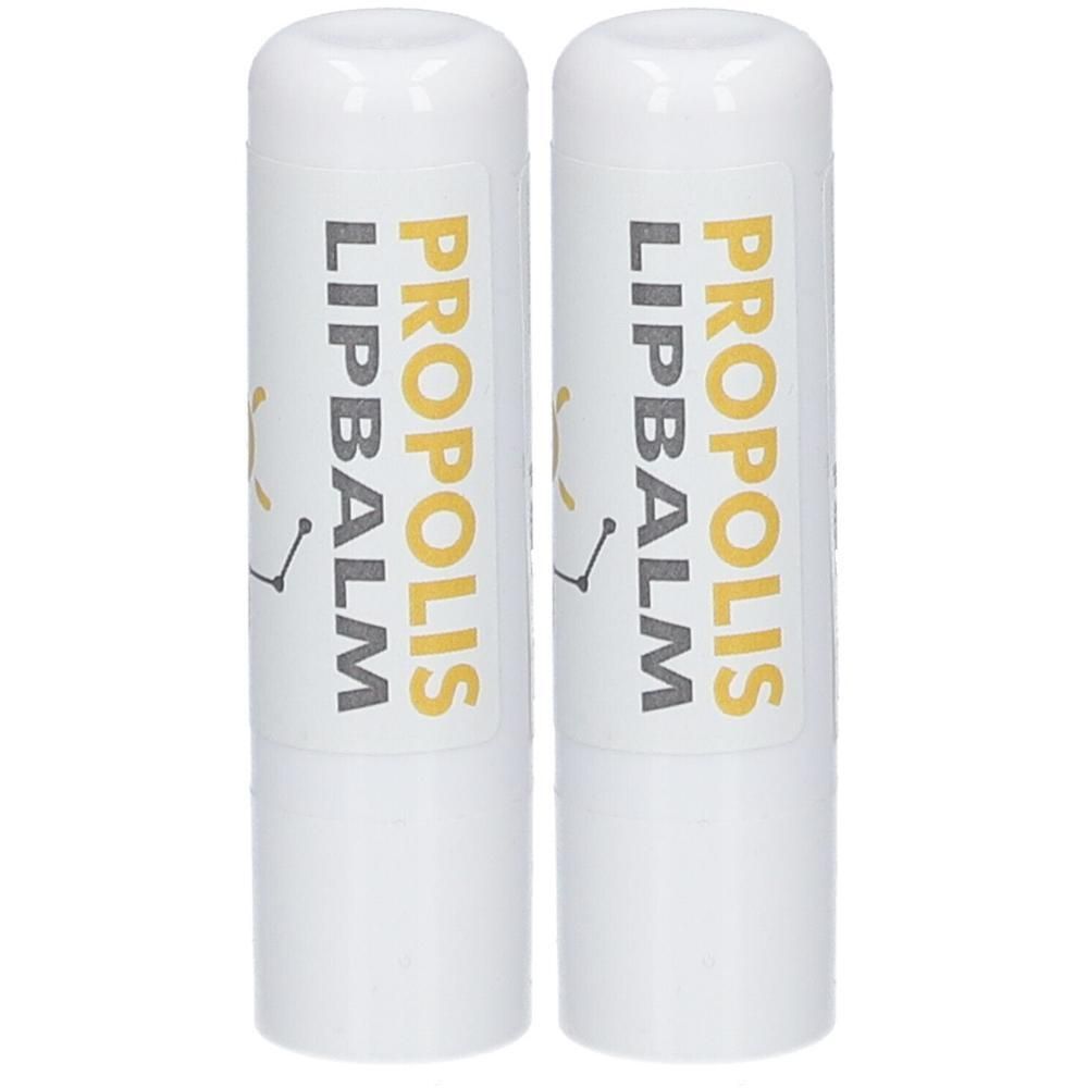 Deux baumes à lèvres blancs avec l'inscription "PROPOLIS LIPBALM".