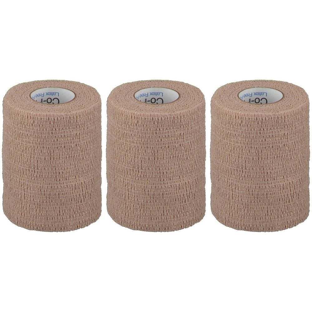 Trois rouleaux de bandage couleur peau. Le logo "Co-Plus Latex Free" est visible sur le dessus.
