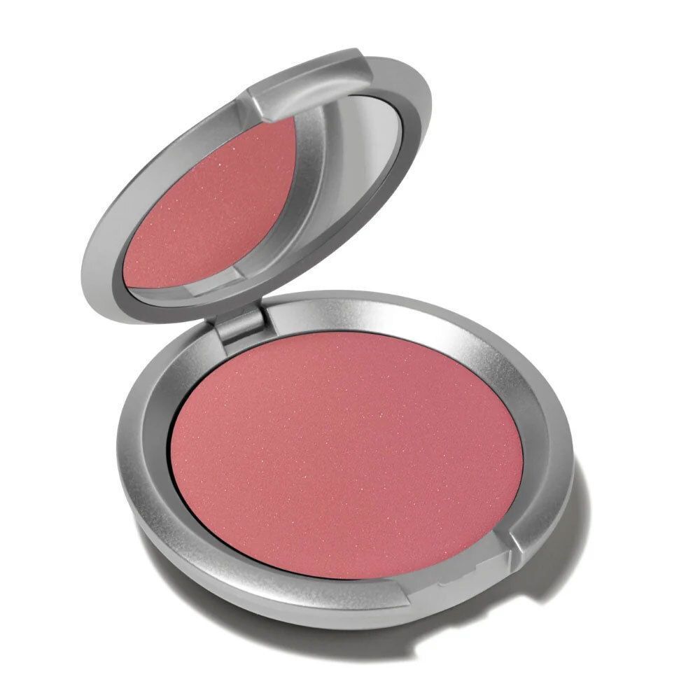 Un boîtier ouvert de poudre blush rose avec miroir.