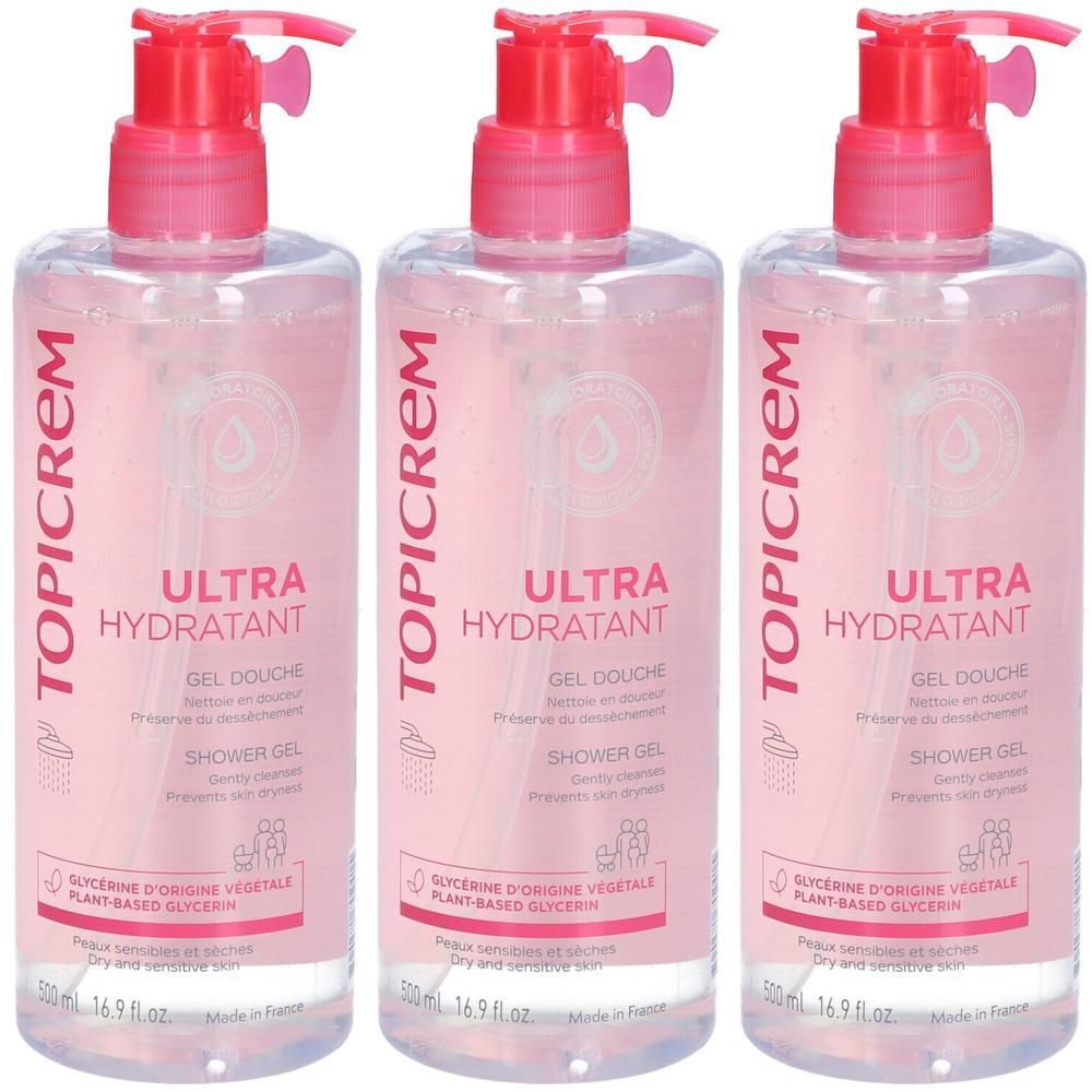 Drie flessen Topicrem Ultra Hydratant douchegel met roze pompkopjes.
