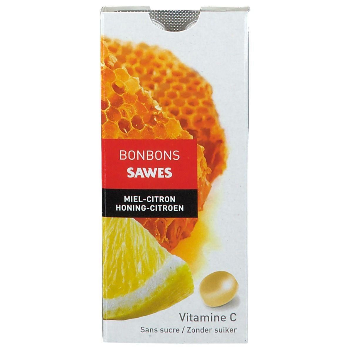 Boîte de bonbons Sawes Miel-Citron sans sucre, avec Vitamine C. Montre un rayon de miel et une tranche de citron.