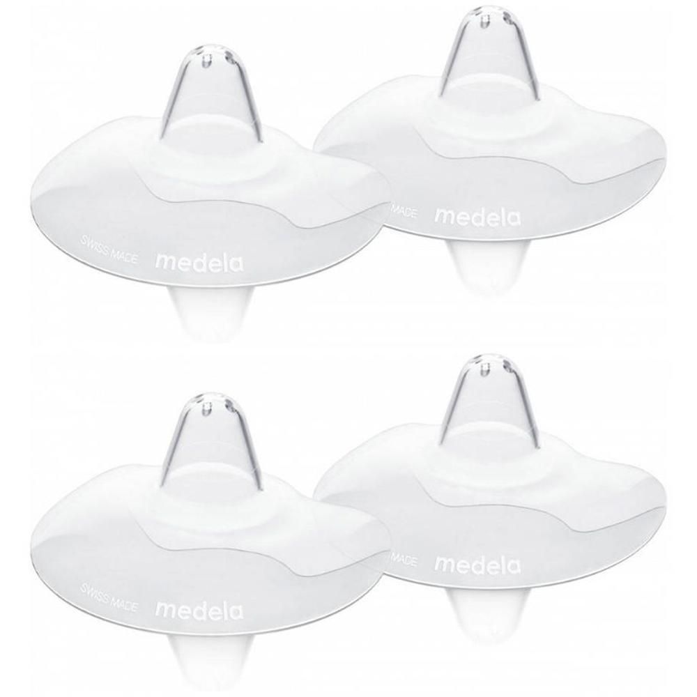 Quatre bouts de sein Medela en silicone transparent. Taille S, avec trous d'aération.