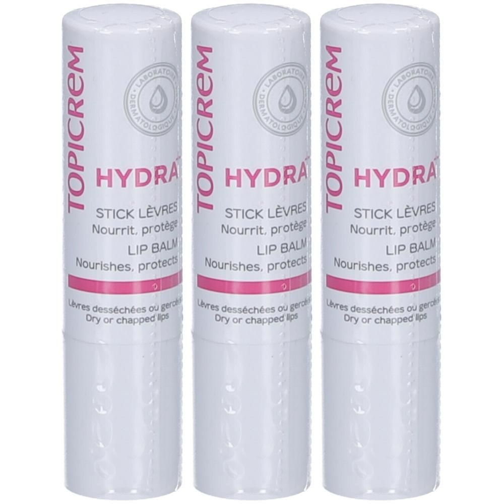Drie Topicrem Hydra lippenbalsemstiften. Witte houders met roze en grijze belettering.