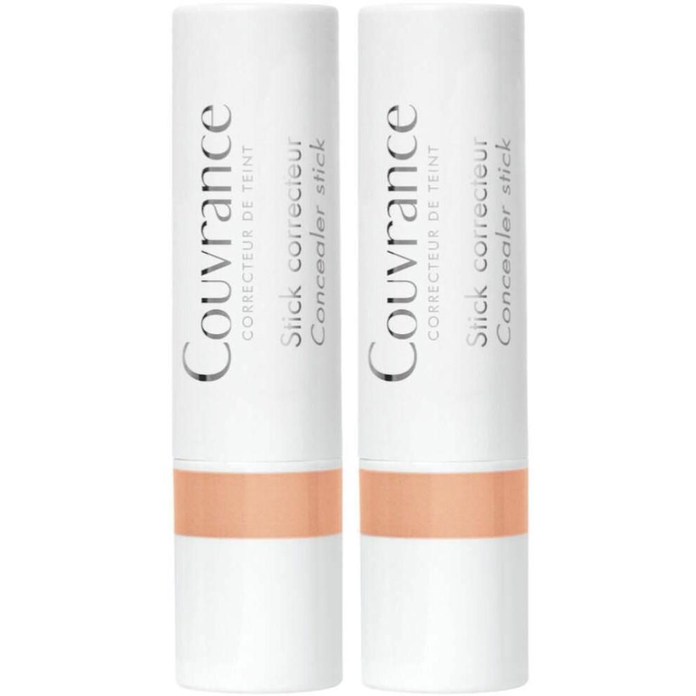 Deux sticks correcteurs blancs avec bande corail et inscription 'Couvrance Correcteur de teint'.