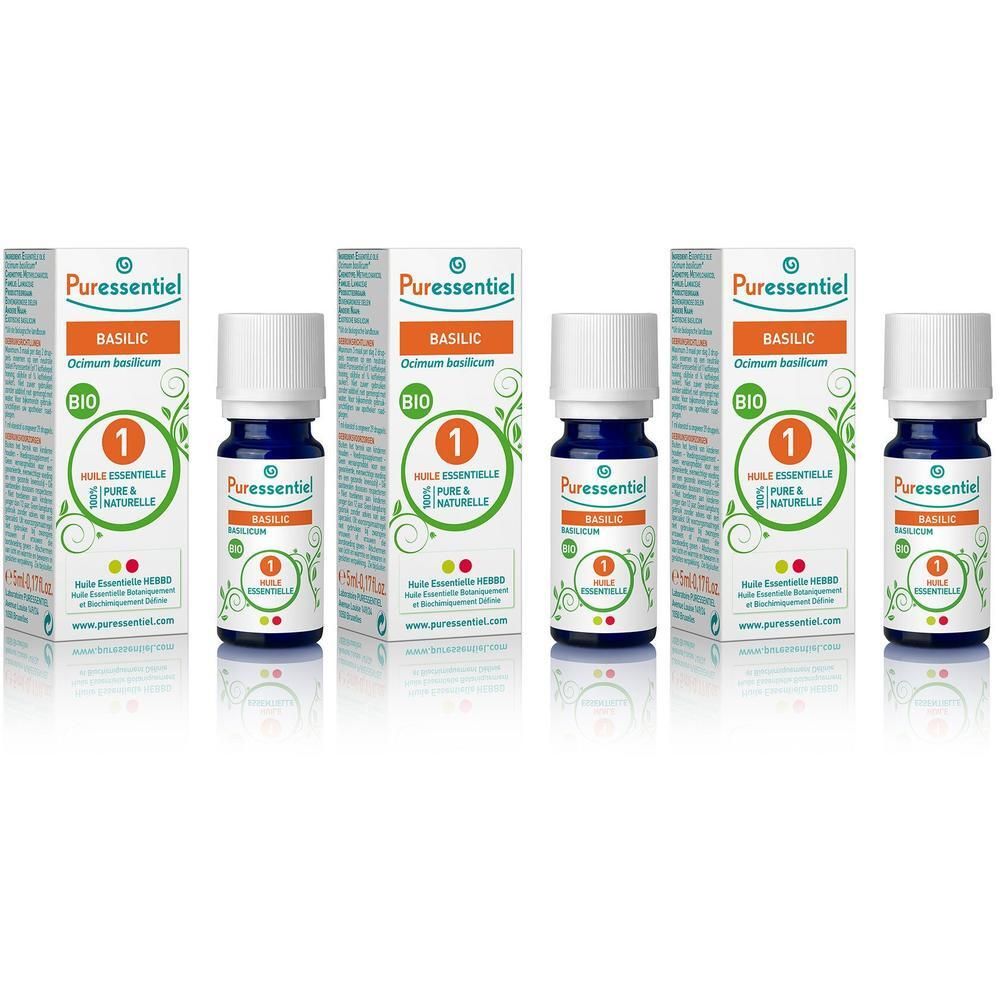 Huile essentielle bio Basilic Puressentiel en flacons de verre foncé avec bouchons blancs et boîtes.