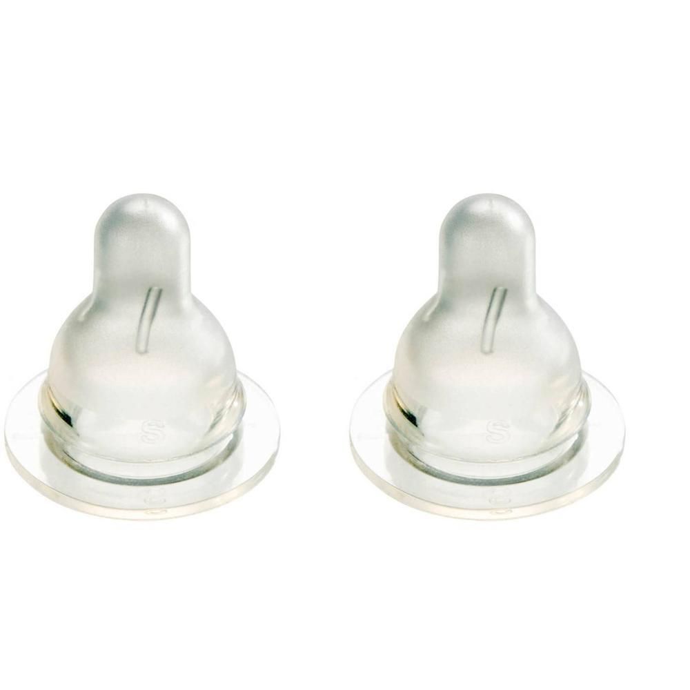 Deux tétines transparentes avec une fente étroite.