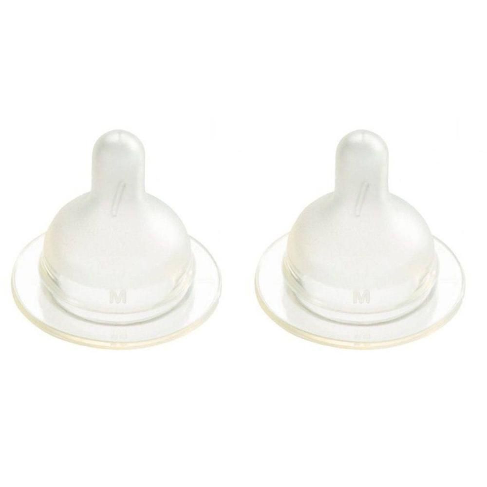 Deux tétines transparentes avec marquage "M" pour débit moyen.