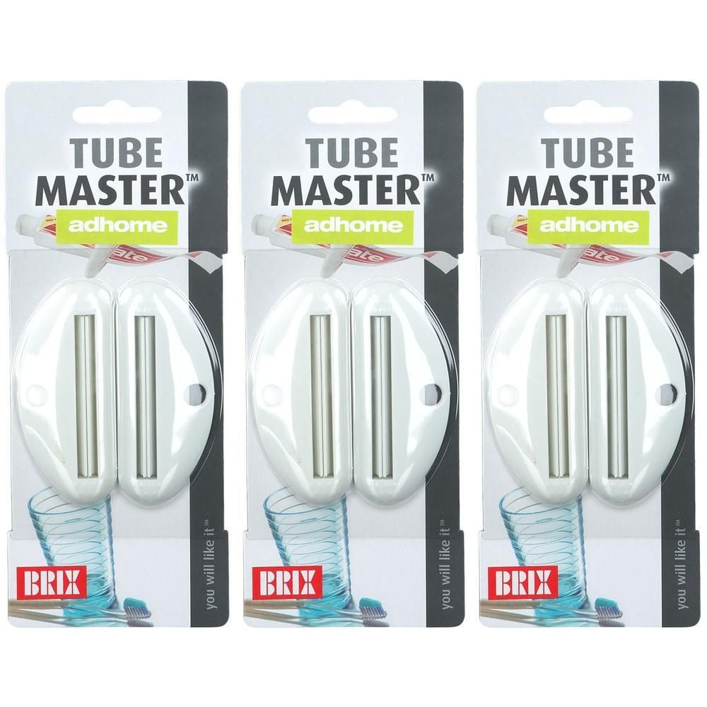 Trois dévidoirs de tube blancs avec rouleaux argentés, emballés sous blister.