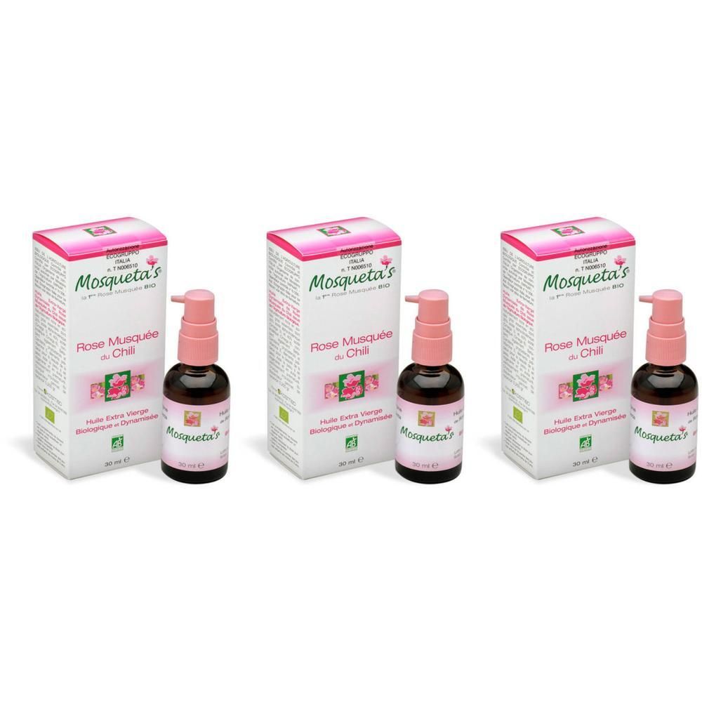 Drie flessen biologische rozenbottelolie met pompen en doosjes.