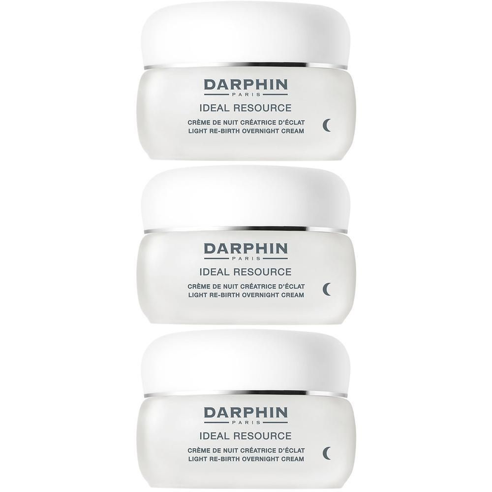 Trois pots de crème de nuit Darphin Ideal Resource, blancs avec un bord argenté.