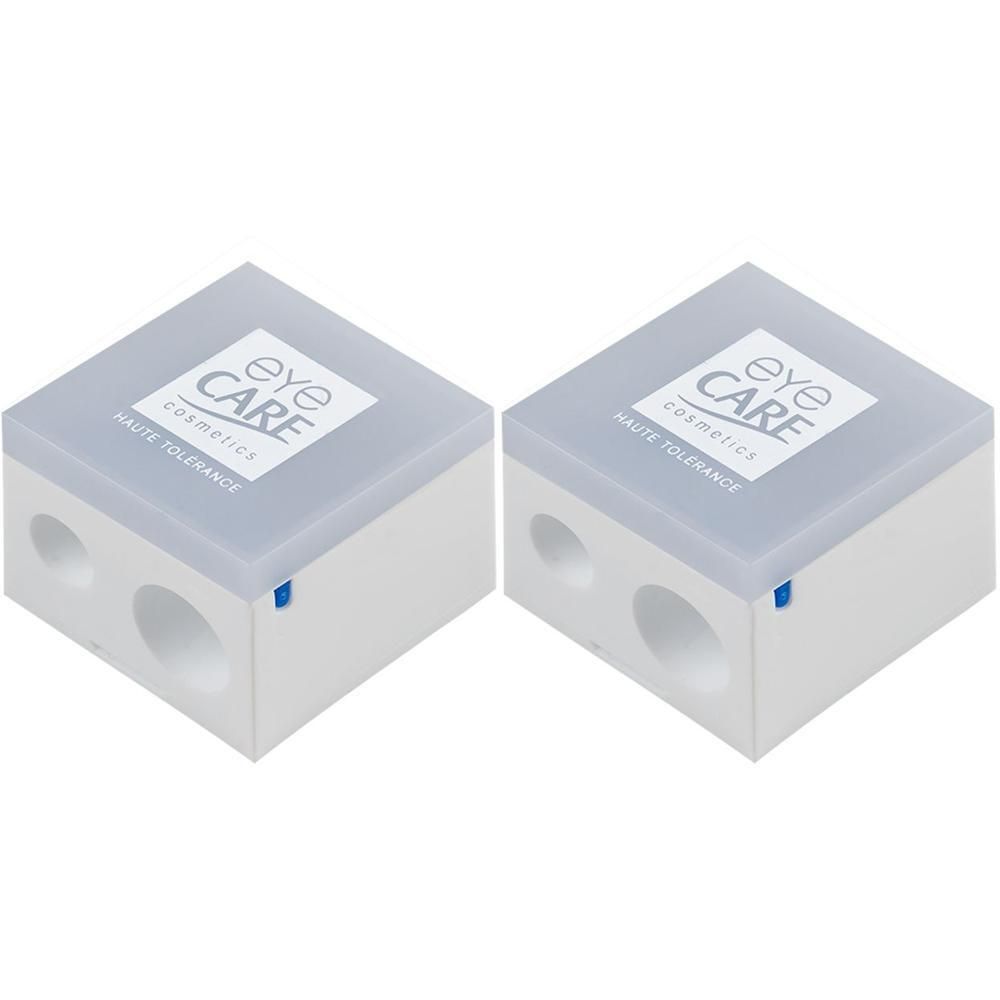 Deux taille-crayons blancs avec le logo 'eye CARE Cosmetics Haute Tolerance'.