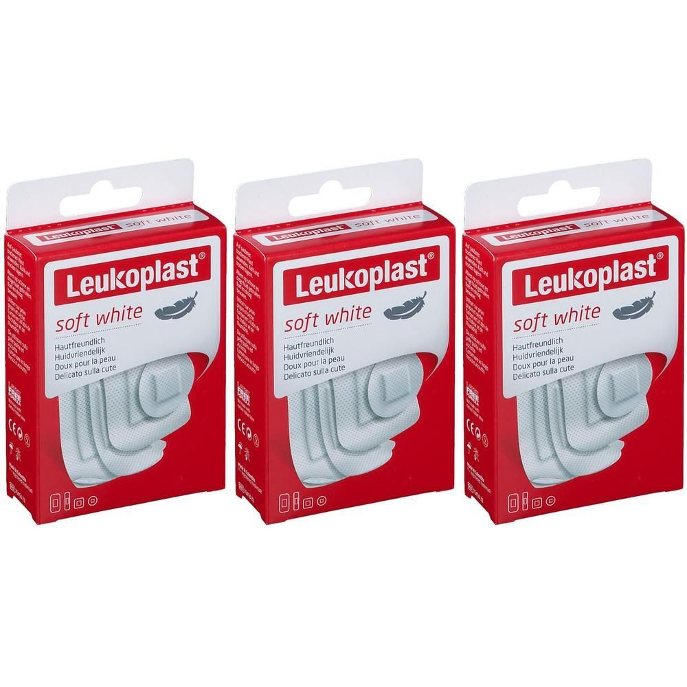 Trois boîtes de Leukoplast Soft White. Emballage rouge, produit blanc. Inscription: soft white, symbole de plume.