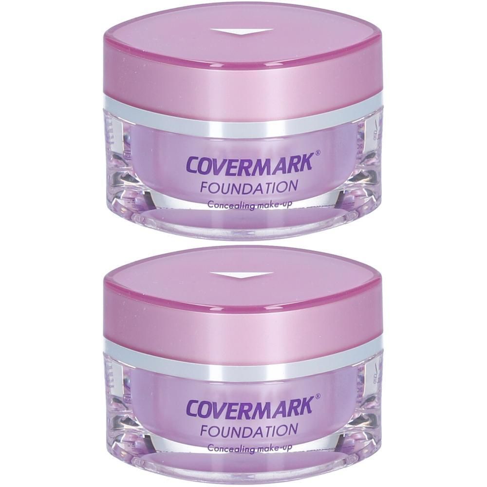 Deux pots de fond de teint COVERMARK Concealing Make-up avec couvercle violet et récipient transparent.