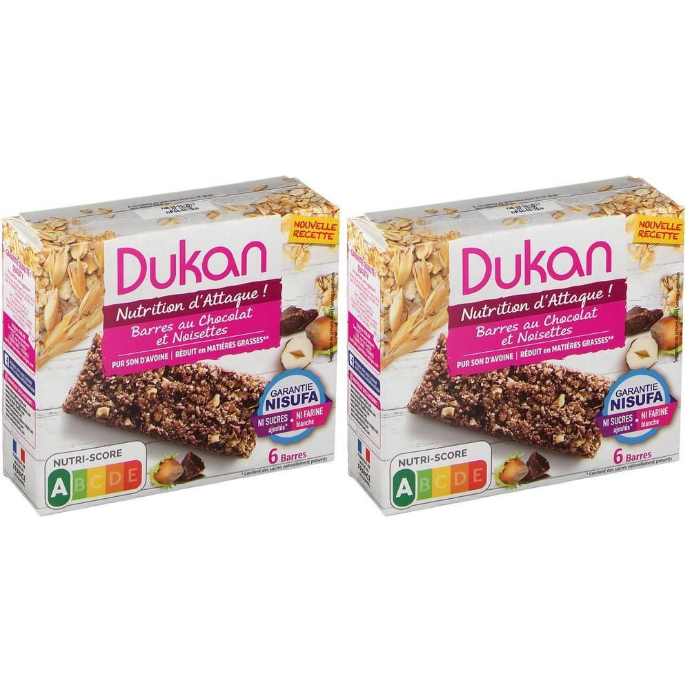 Twee pakken Dukan chocoladerepen met noten. Elk pak bevat 6 repen.