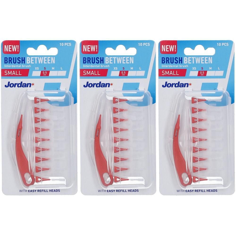 Trois paquets de brossettes interdentaires Jordan, taille S (0,5 mm), avec manches rouges et poils blancs.