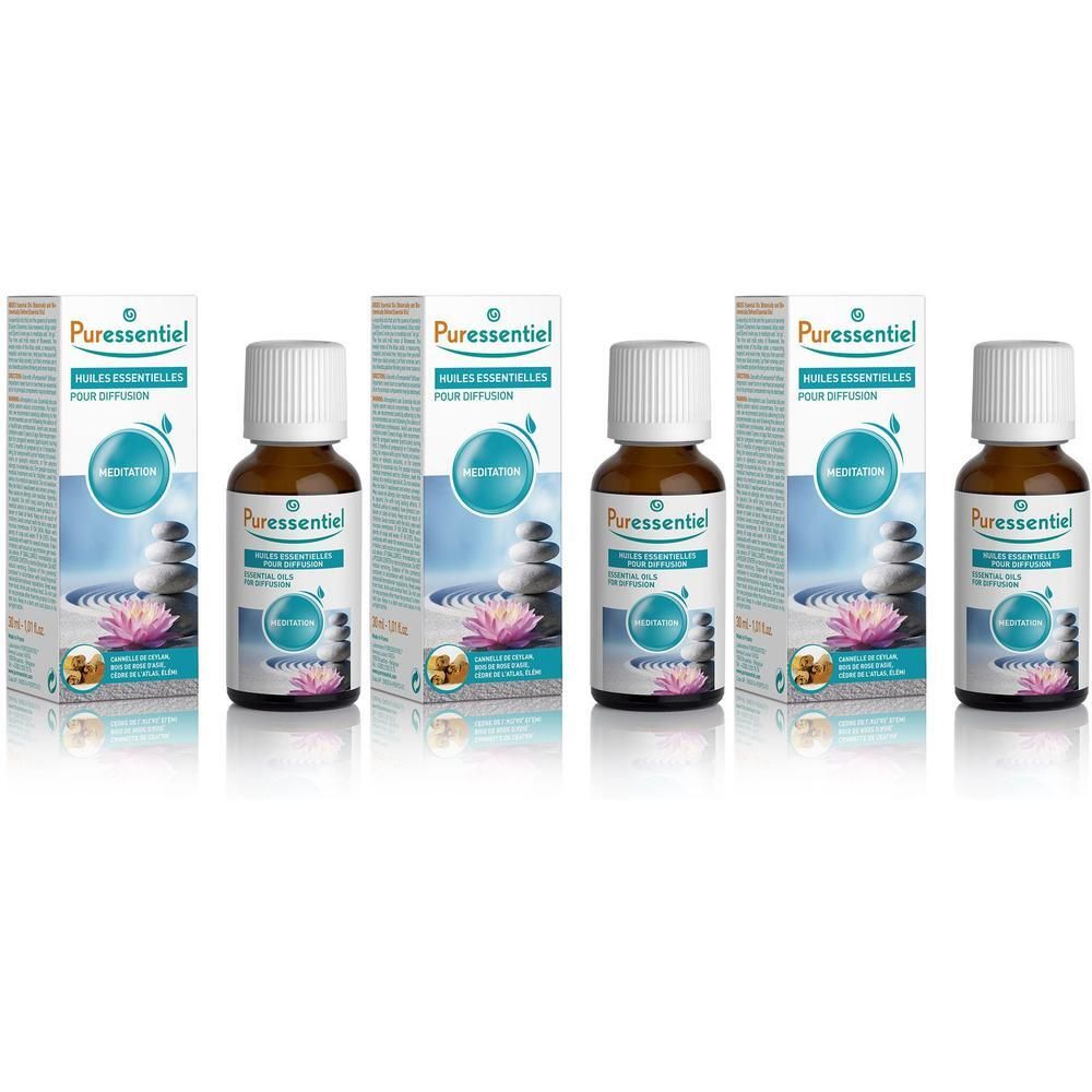 Quatre flacons d'huiles essentielles Puressentiel Méditation pour diffusion. Flacons en verre brun avec bouchons blancs.