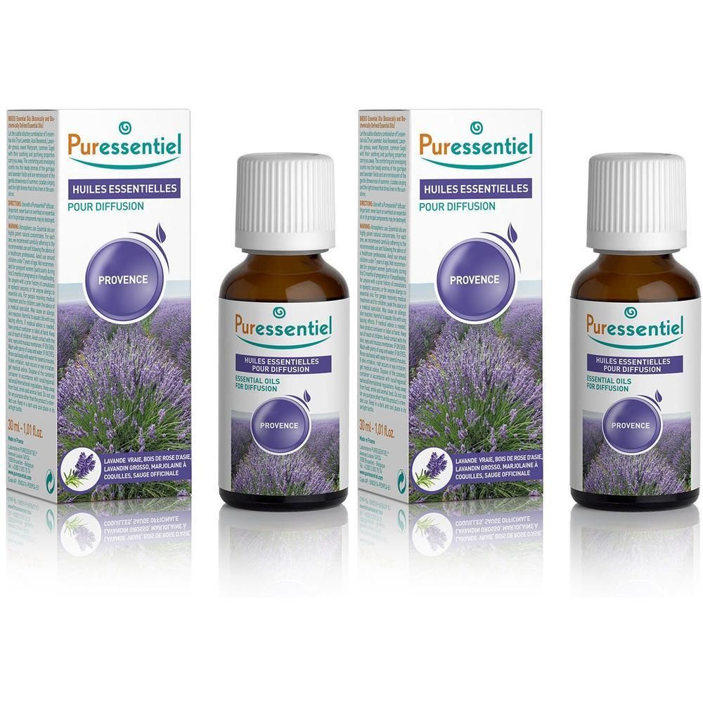 Puressentiel Provence etherische oliën voor diffusie in bruine glazen flesjes met witte doppen, twee doosjes op de achtergrond.