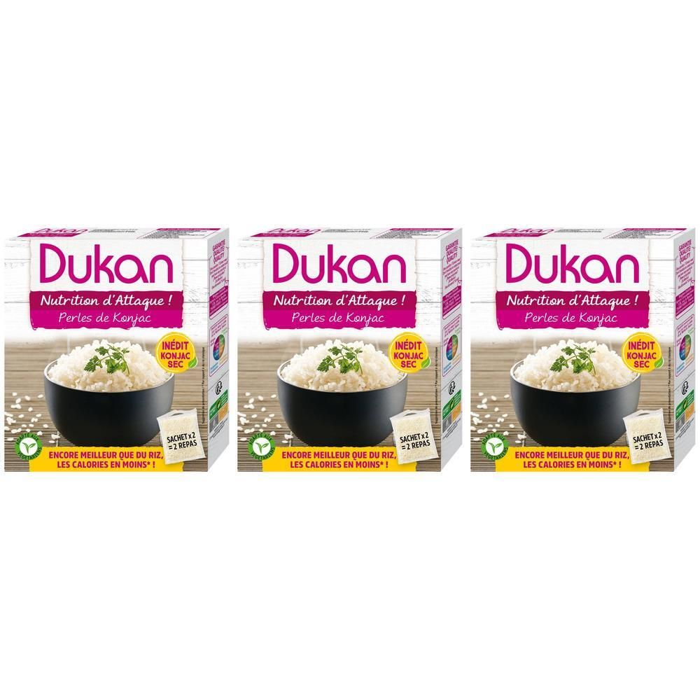 Drie pakken Dukan Konjac rijstparels met een kom rijst erop.