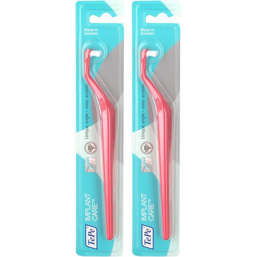 Deux brosses TePe Implant Care à touffe unique roses, emballées dans un blister avec fond bleu.