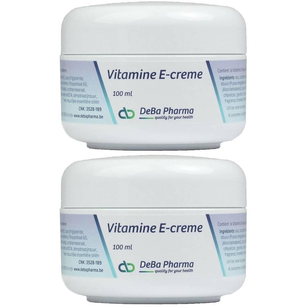 Deux pots blancs de crème à la Vitamine E DeBa Pharma, 100 ml chacun.