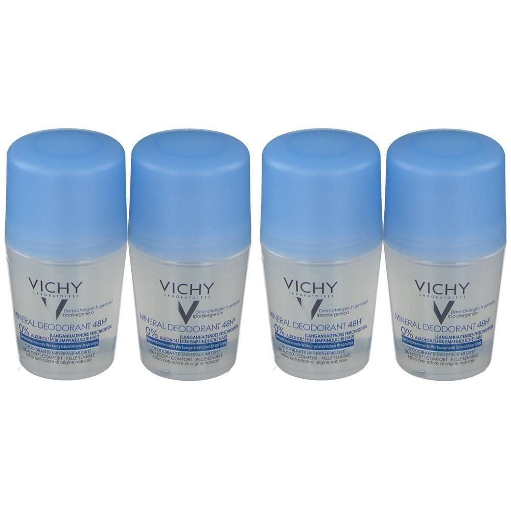 Vier Vichy Mineral Deodorant roll-ons met blauwe doppen.
