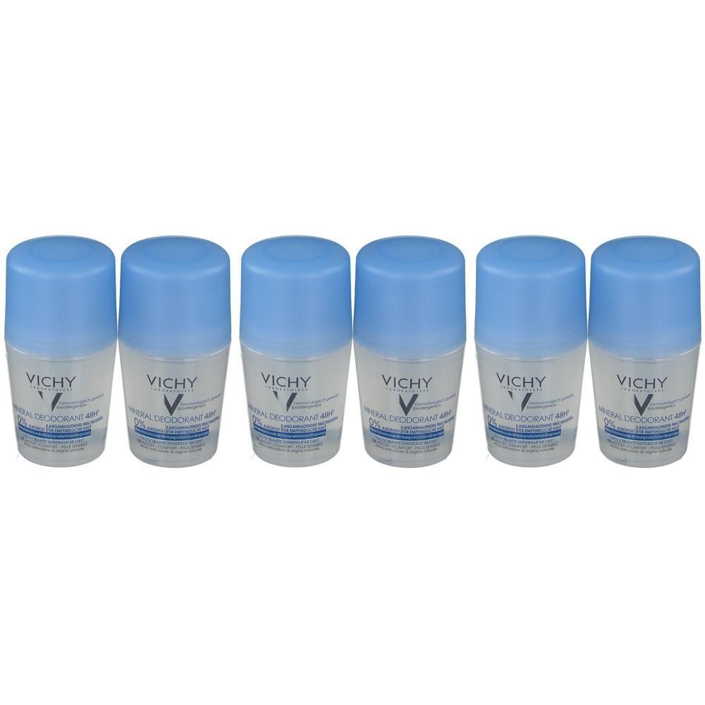 Zes Vichy Mineral Deodorant roll-ons met blauwe doppen.