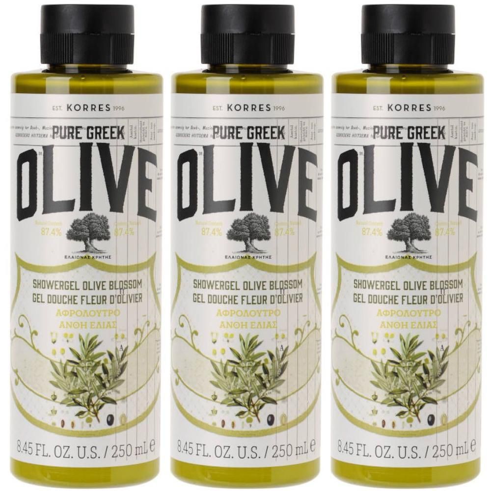 Drie flessen Korres Pure Greek Olive Shower Gel Olive Blossom met zwarte dop en etiket met olijfboomafbeelding.
