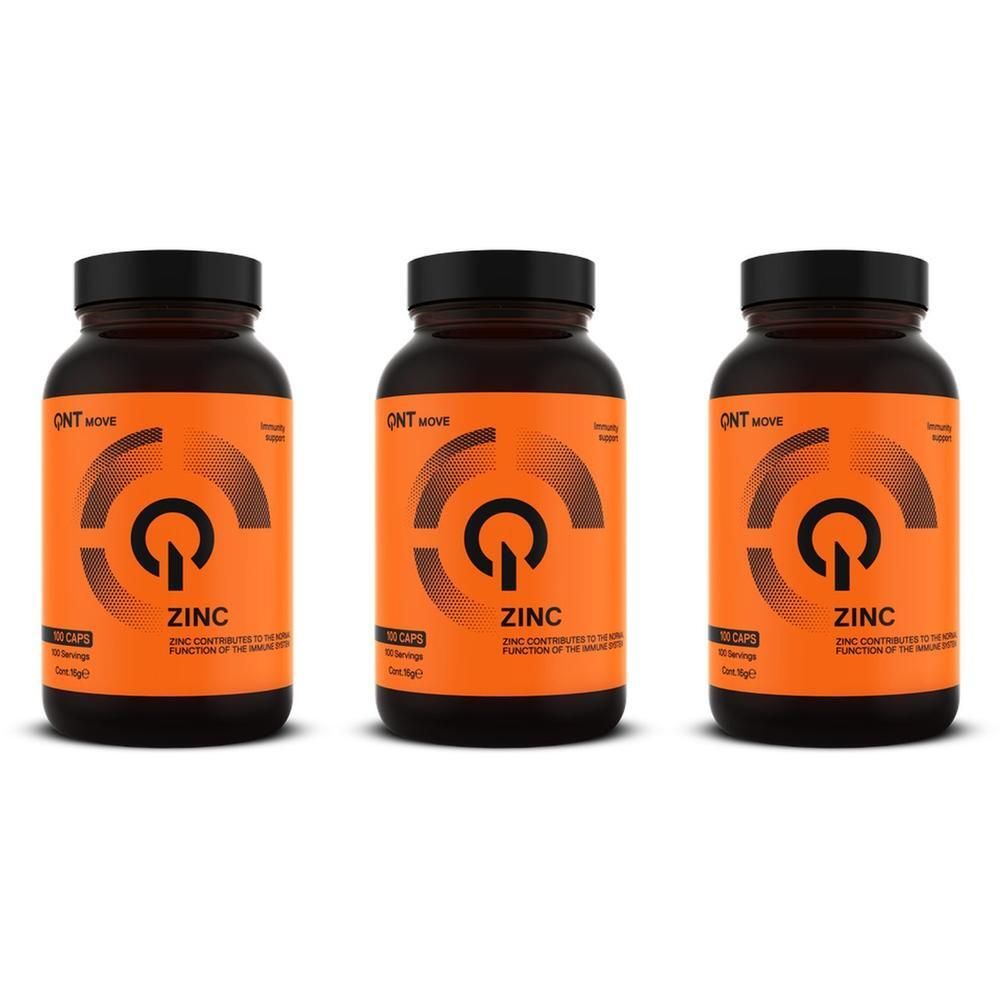 Drie flessen QNT Zink supplementen met oranje etiketten en zwarte doppen.