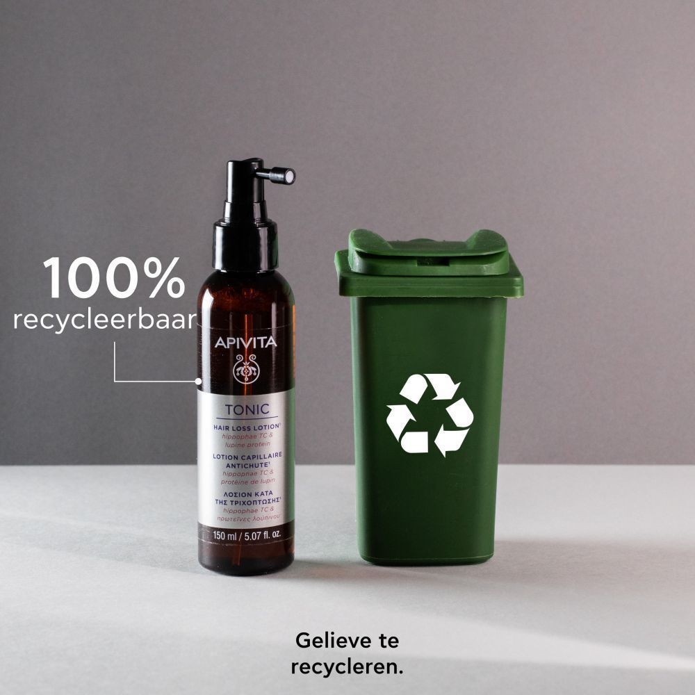 Apivita Hair Loss Lotion Tonic naast een groene prullenbak. Tekst: 100% recyclebaar.