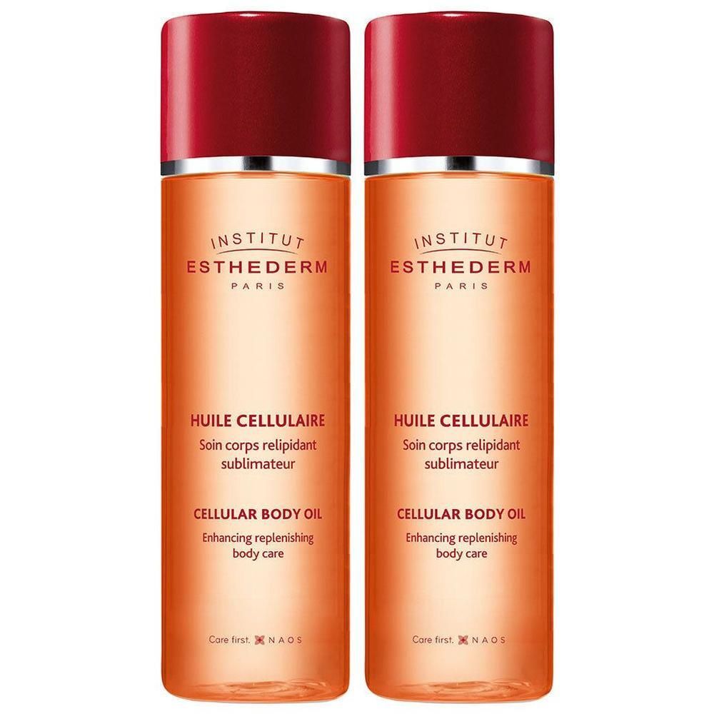 Deux flacons d'Huile Cellulaire Institut Esthederm avec bouchons rouges.
