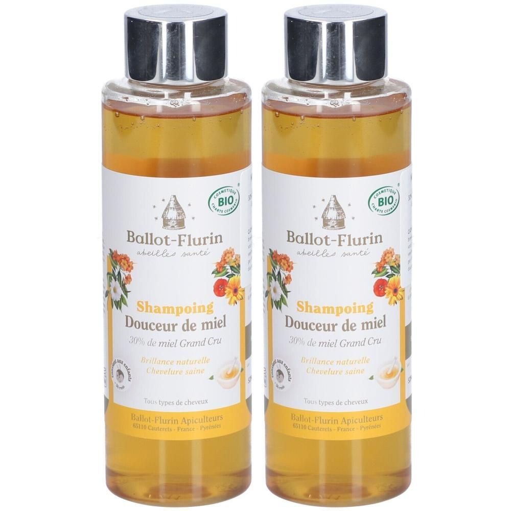 Deux flacons de shampoing Douceur de Miel Ballot-Flurin, bouchons argentés. Liquide jaune, étiquettes avec fleurs et ruche.
