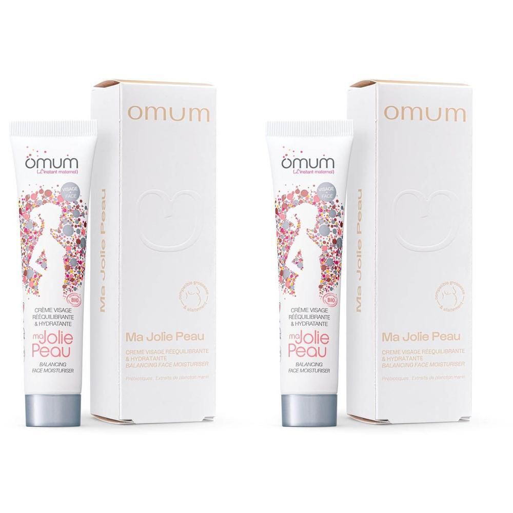 Twee tubes Omum Ma Jolie Peau hydraterende crème met doosjes en bloemenpatroon.