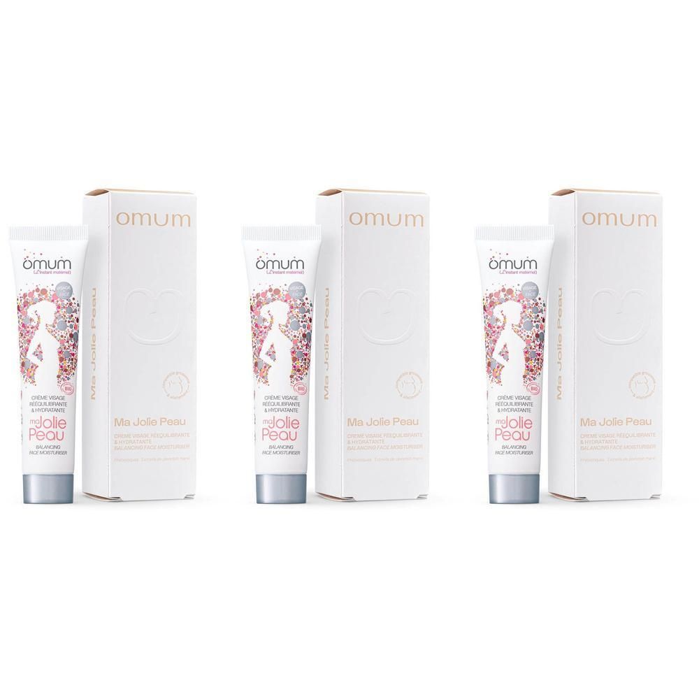 Drie tubes en dozen Omum Ma Jolie Peau Gezichtscrème met bloemenpatroon.