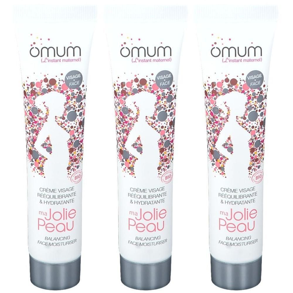 Drie tubes Omum Ma Jolie Peau gezichtscrème met bloemenpatroon en silhouet van een zwangere vrouw.
