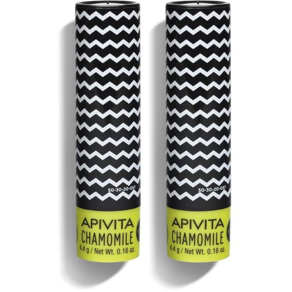 Twee lipbalm verpakkingen met zigzag patroon en gele onderkant. Bevat kamille en SPF15.