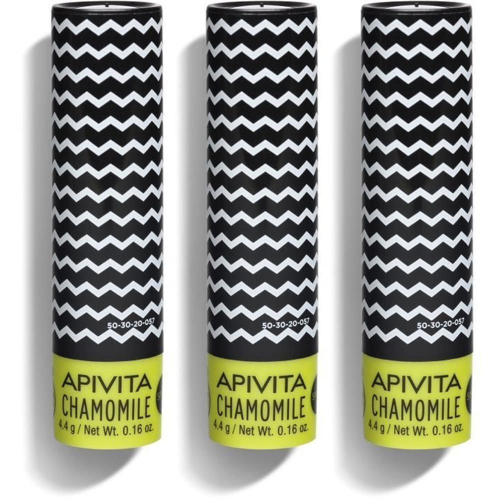 Drie lippenbalsems met zwart zigzagpatroon en gele onderkant. Opschrift: APIVITA CHAMOMILE.