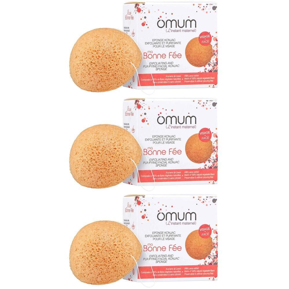 Trois éponges konjac rondes et oranges avec cordon et emballage.