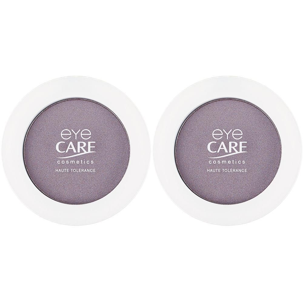 Twee ronde verpakkingen met orchideekleurige oogschaduw. Merk: EYE CARE COSMETICS.