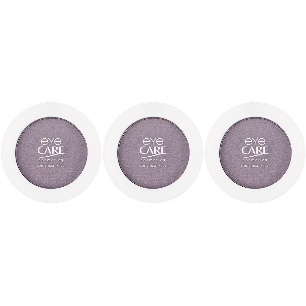 Trois boîtes rondes de fard à paupières lilas. Chaque boîte affiche le logo 'Eye Care Cosmetics Haute Tolerance'.