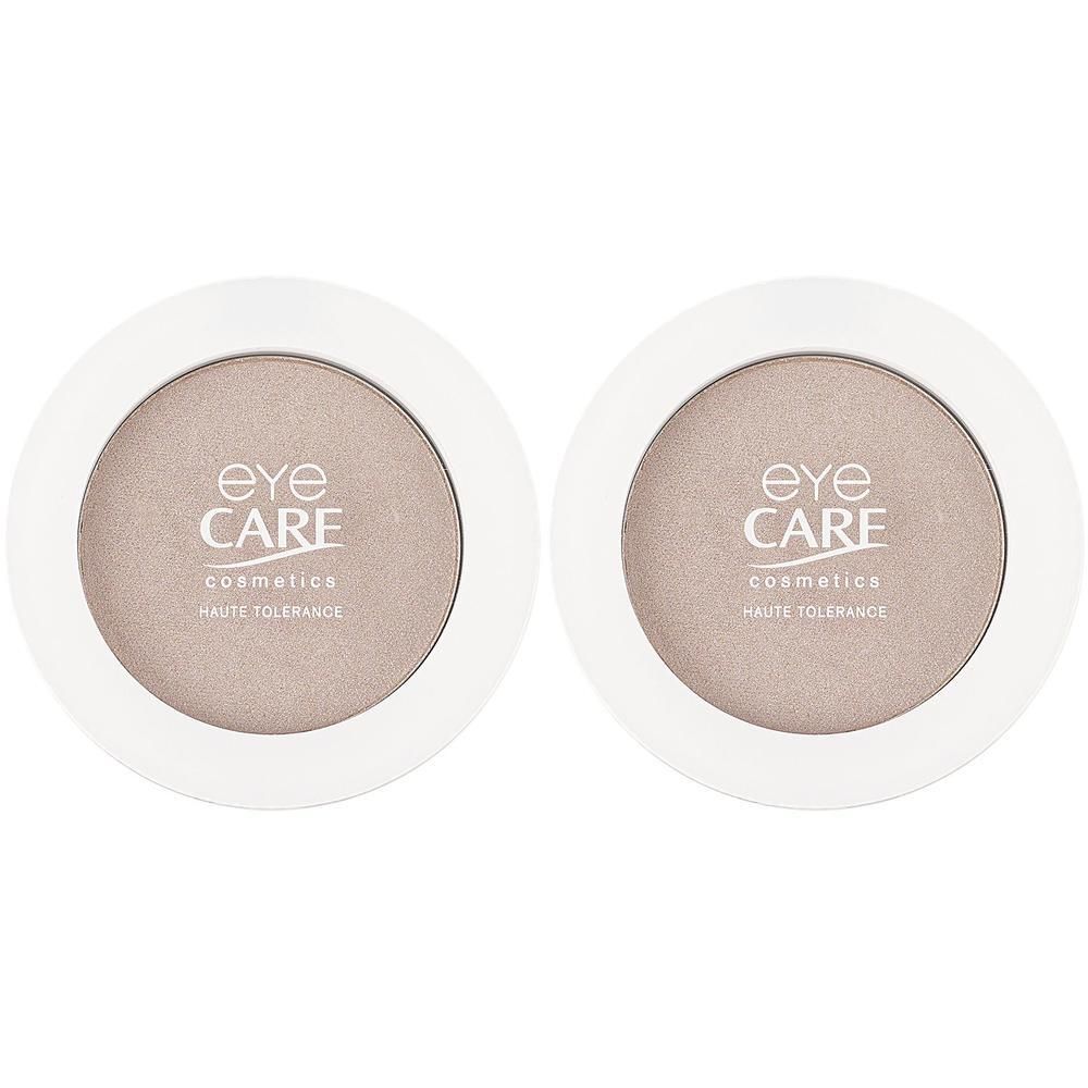 Deux boîtes rondes de fard à paupières avec le logo EYE CARE cosmetics.