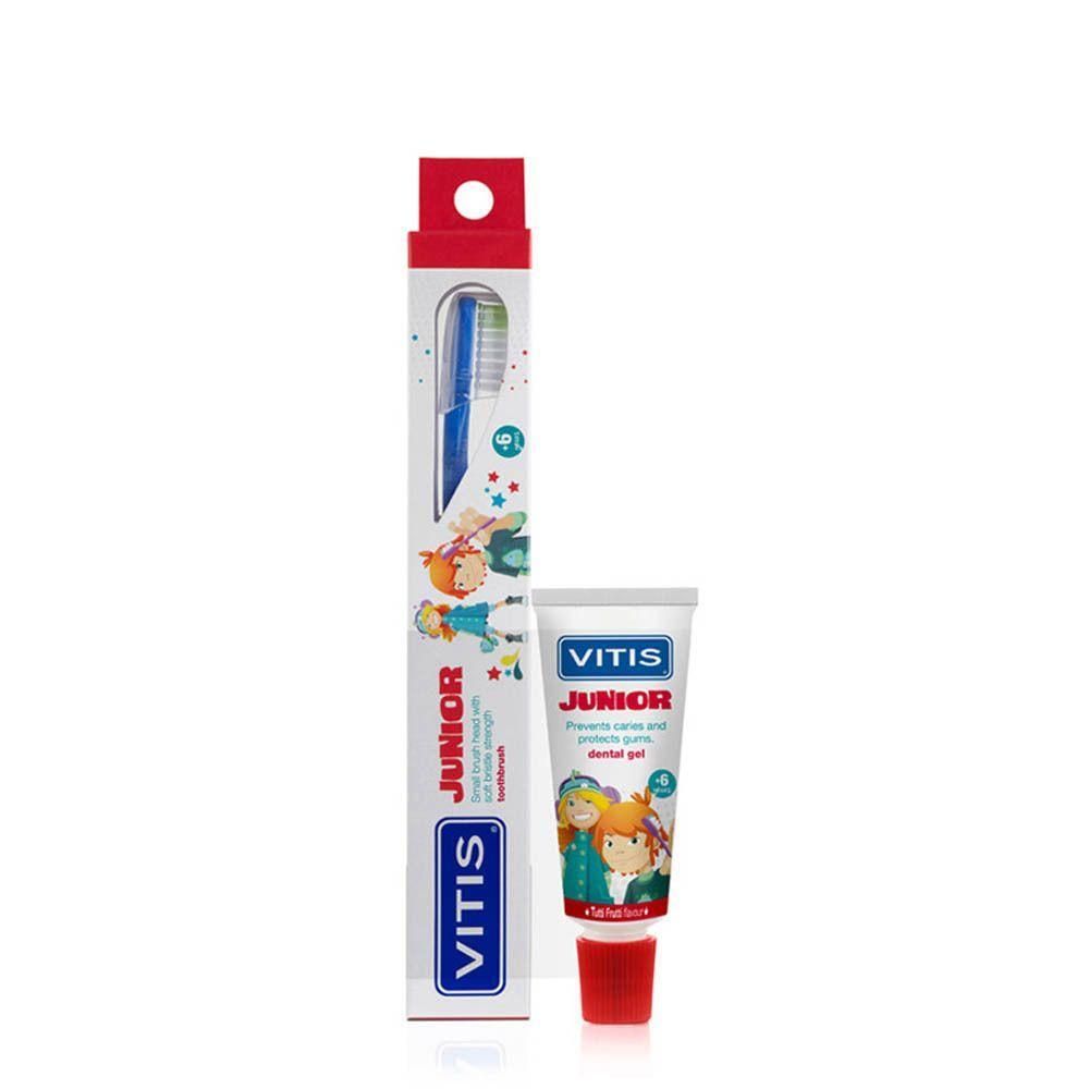 Brosse à dents et gel dentaire Vitis Junior pour enfants. Brosse à dents bleue dans son emballage illustré. Petit tube de gel dentaire blanc.