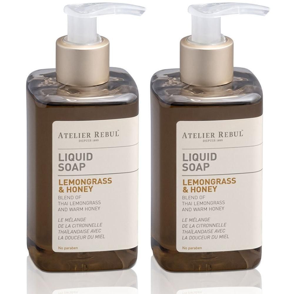 Deux flacons de savon liquide Atelier Rebul Citronnelle & Miel avec distributeurs à pompe.